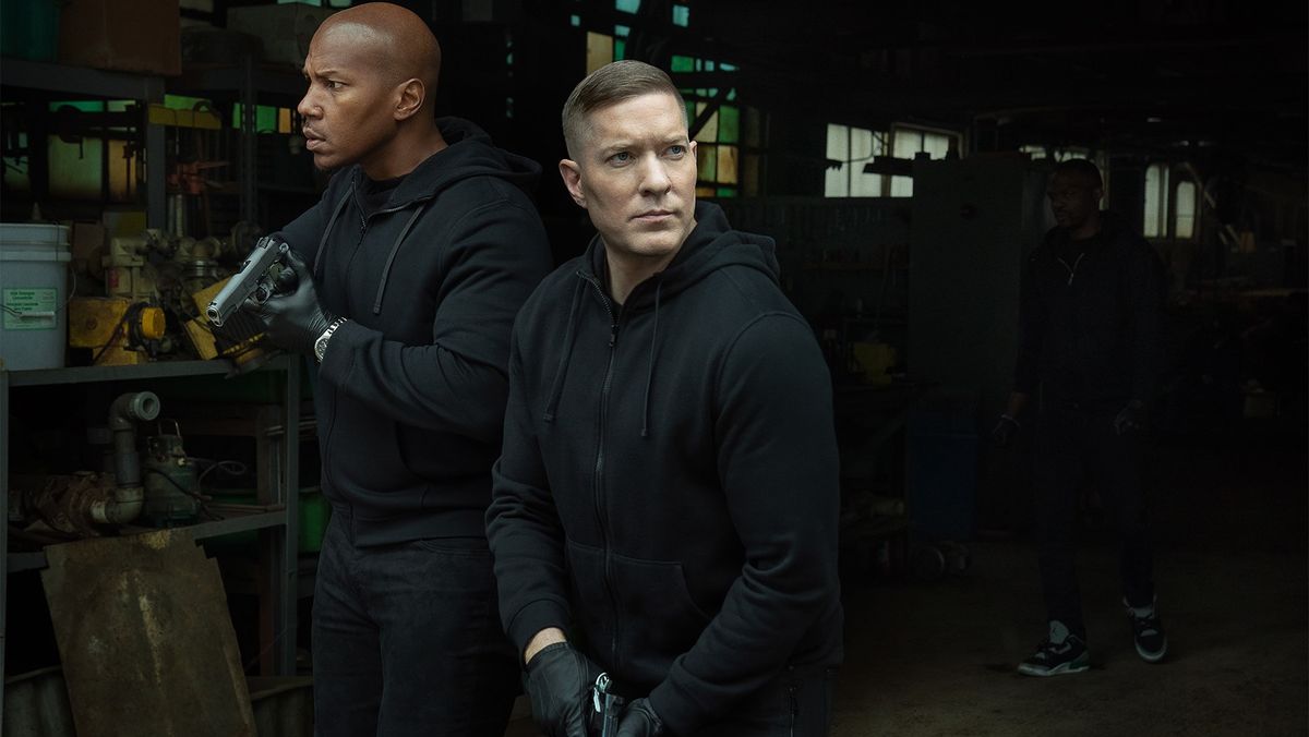 Isaac Keys and Joseph Sikora as Diamond and Tommy in all black holding guns in Power Book IV: Force