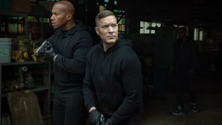 Isaac Keys and Joseph Sikora as Diamond and Tommy in all black holding guns in Power Book IV: Force