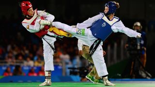 ade Jones of Great Britain competes against Eva Calvo Gomez of Spain during the Women's -57kg Gold Medal Taekwondo contest