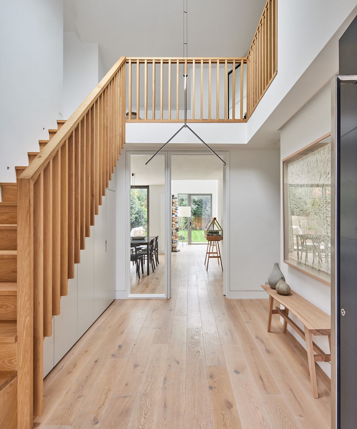 Hallway with new wooden staircase and wood floor