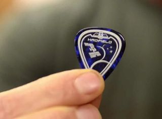 A close-up of the cosmic guitar pick to be used by Canadian astronaut Chris Hadfield during his Expedition 35 mission to the International Space Station in late 2012 and early 2013. The pick resembles Hadfield's Expedition 35 mission patch.