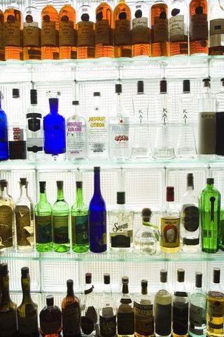 Yellow, Bottle, Alcohol, Glass bottle, Liquid, Drink, Alcoholic beverage, Drinkware, Bottle cap, Distilled beverage,