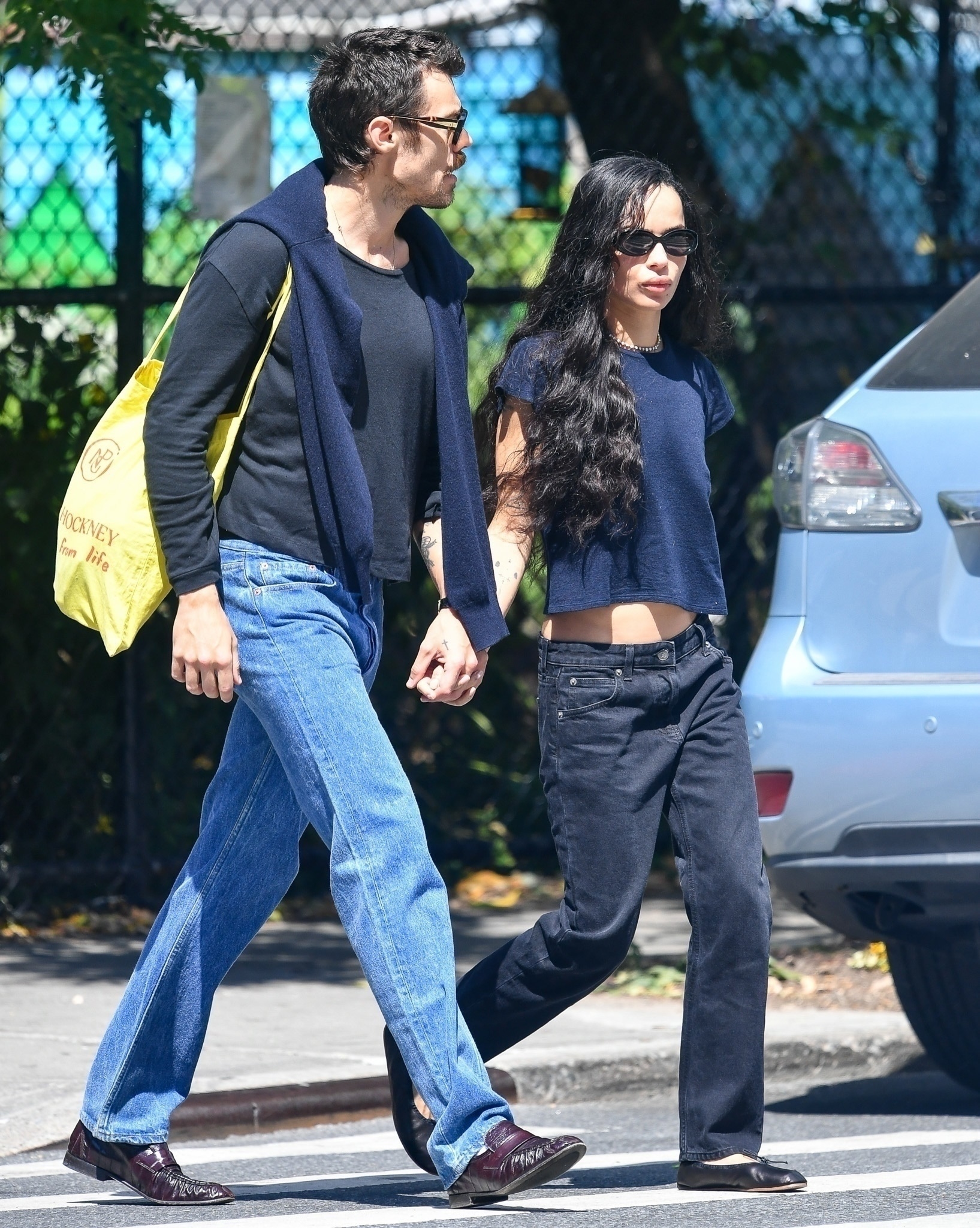 Zoe Kravitz in navy t-shirt and black pants