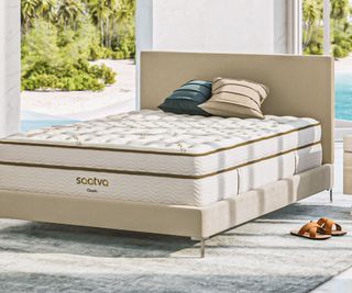 Saatva Classic Mattress in a bedroom with a pool view.