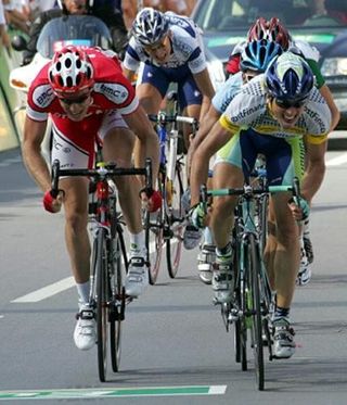 Michael Albasini (R) outsprints Gregory Rast to win stage 5