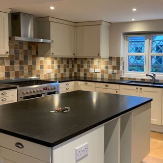 kitchen before makeover with island and cabinetry