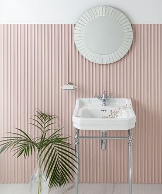 Blush pink bathroom with ribbed, textured wall