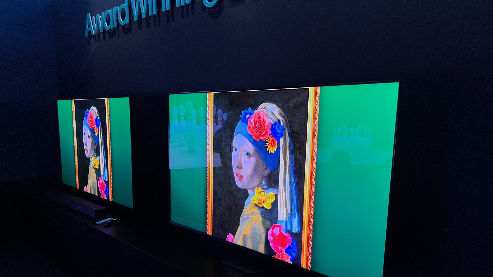 Hisense U8N TVs showing Vermeer painting