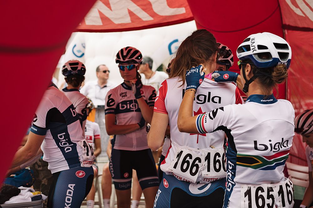 Bigla riders prepare for the podium after the stage in Aprica