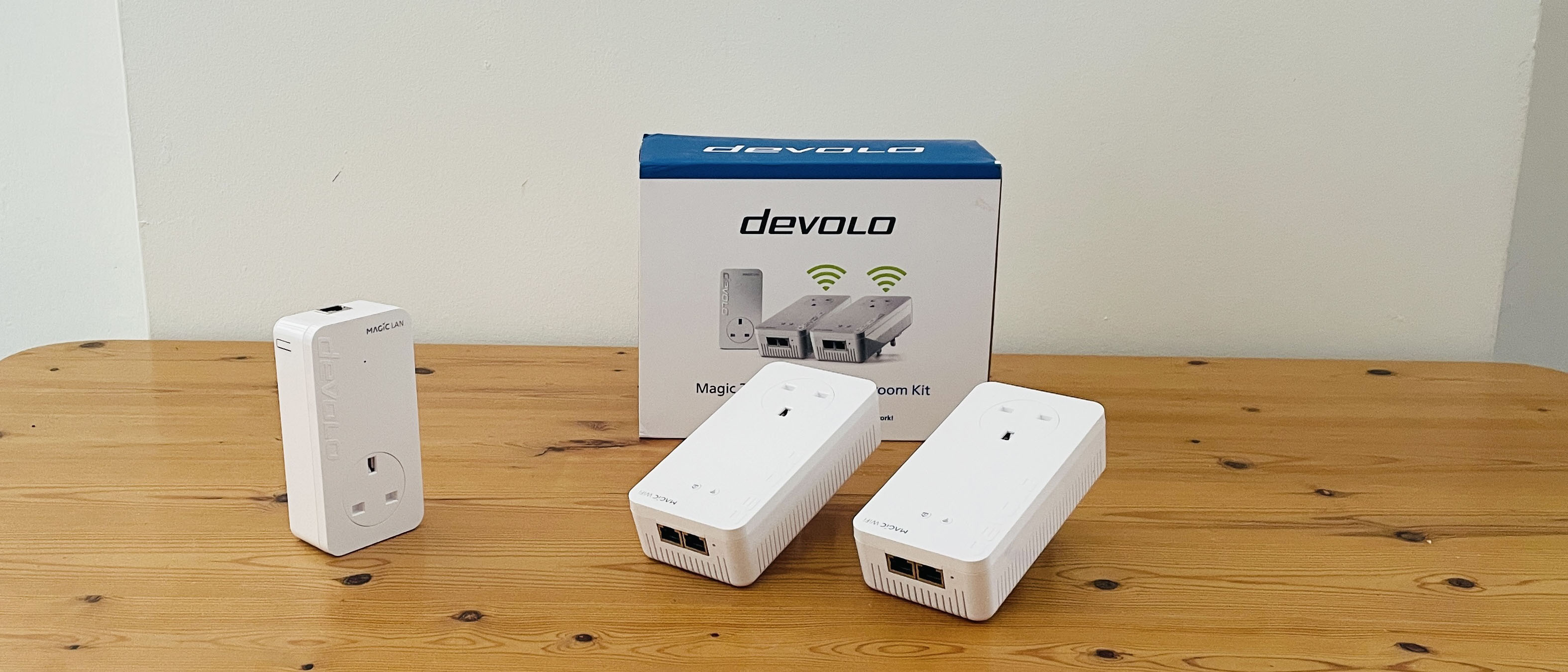 Devolo Magic 2 WiFi 6 next on wooden table