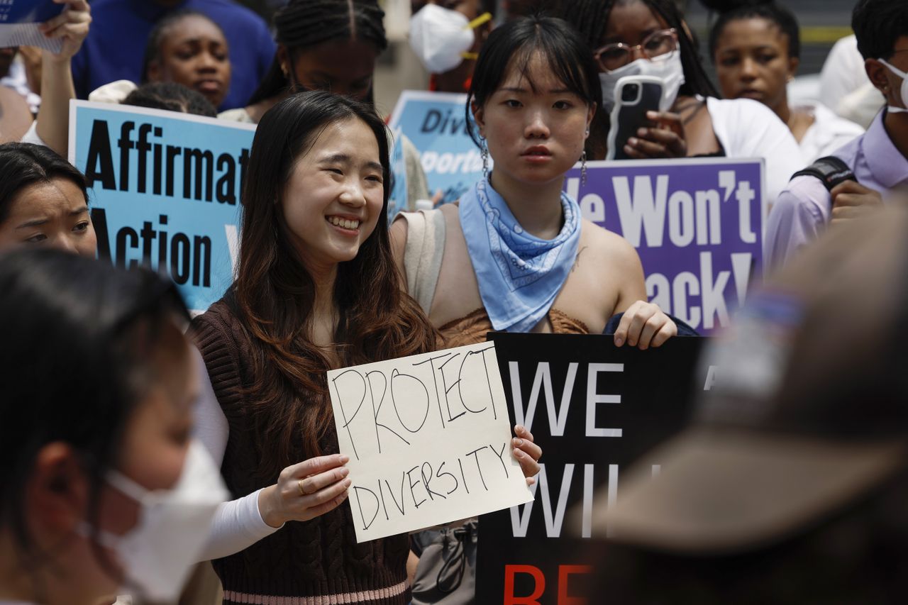 Protesters supporting affirmative action hold signs saying &amp;#039;protect diversity&amp;#039;