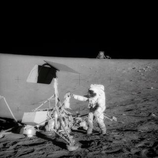 A television camera and several other pieces were taken from Surveyor 3 and brought back to Earth for scientific examination. Here, Apollo 12 moonwalker, Pete Conrad, examines the Surveyor’s TV camera before detaching the gear.