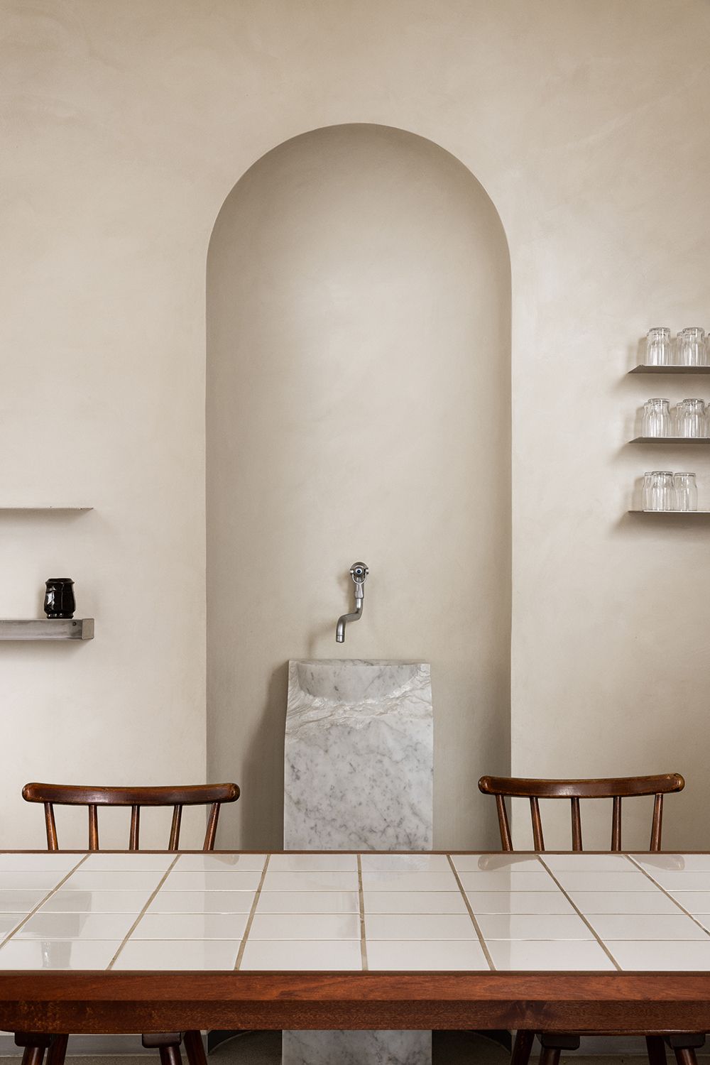 white dining table with metal faucet