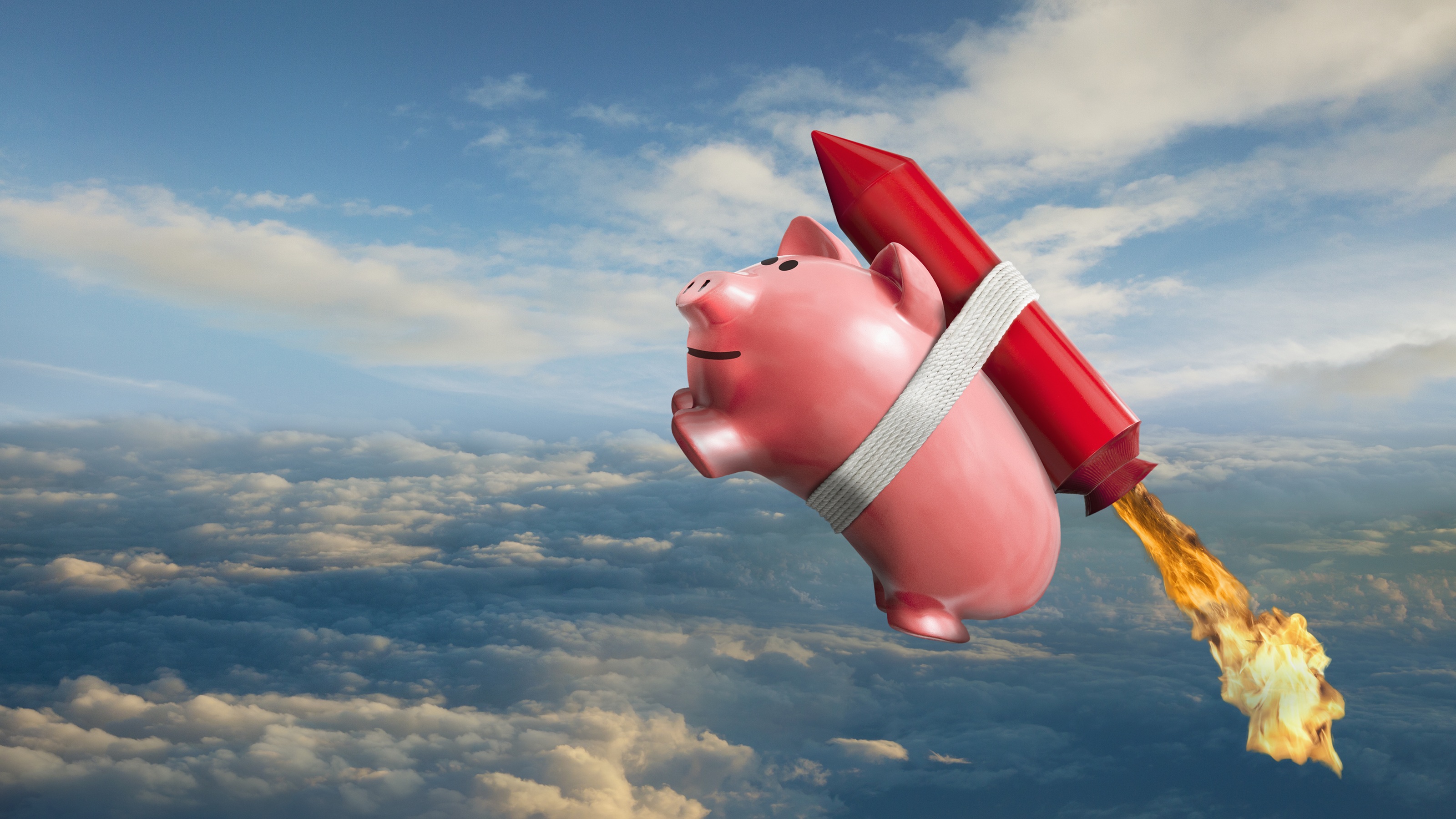 A piggy bank with a rocket strapped to its back soars into the sky.