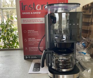 Instant Grind & Brew Coffee Maker unboxed on the countertop