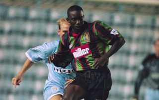 Dwight Yorke of Aston Villa lays the ball off during the FA Carling Premiership match between Coventry City and Aston Villa held on August 29, 1994 at Highfield Road, in Coventry, England. Aston Villa won the match 1-0.