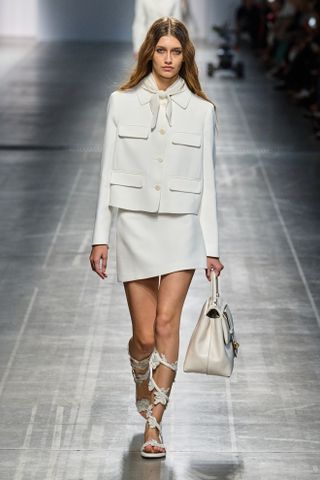 a model walks the spring 2025 runway during Milan Fashion Week