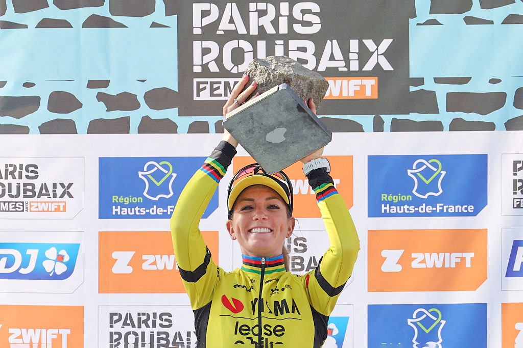 Pauline Ferrand-Pr&amp;eacute;vot (Visma-Lease a Bike) celebrates with the cobblestone trophy after winning the 2025 Paris-Roubaix