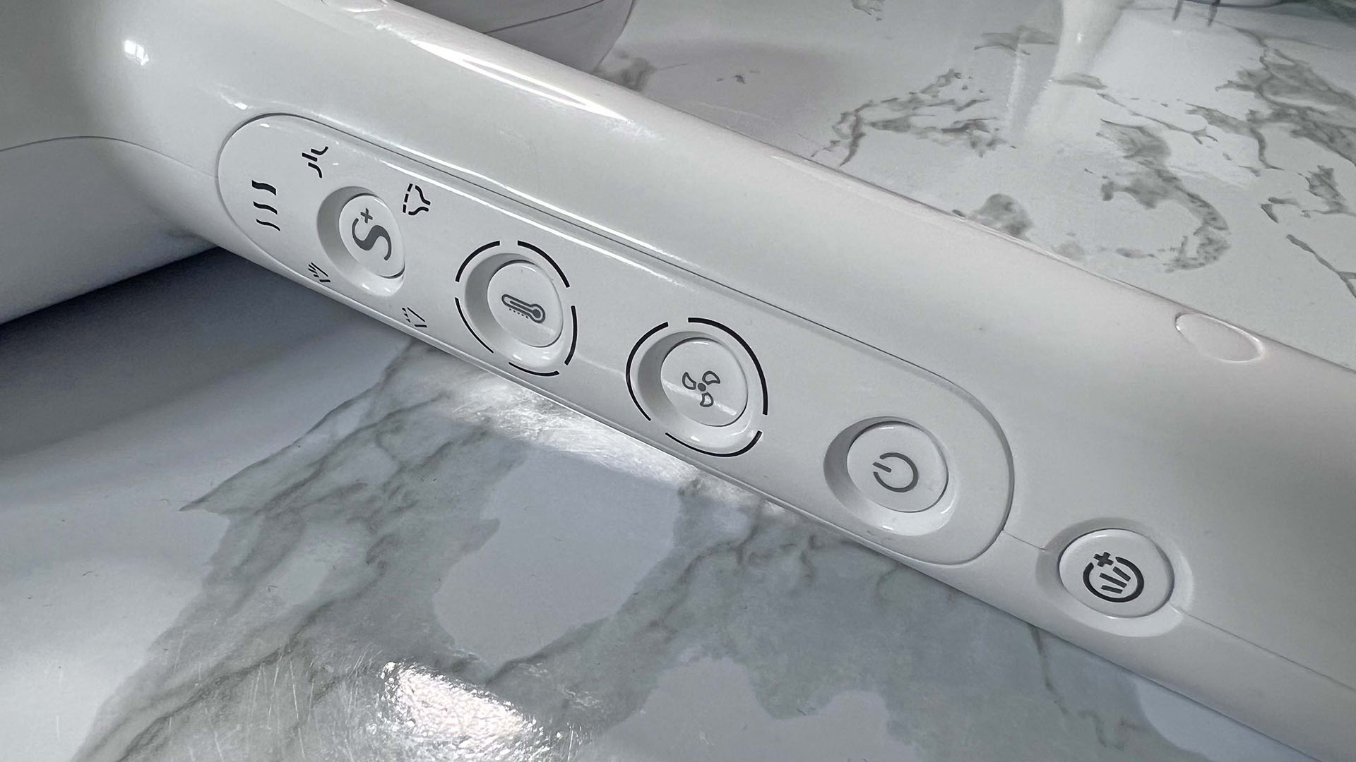 Close up of buttons on T3 Featherweight hair dryer