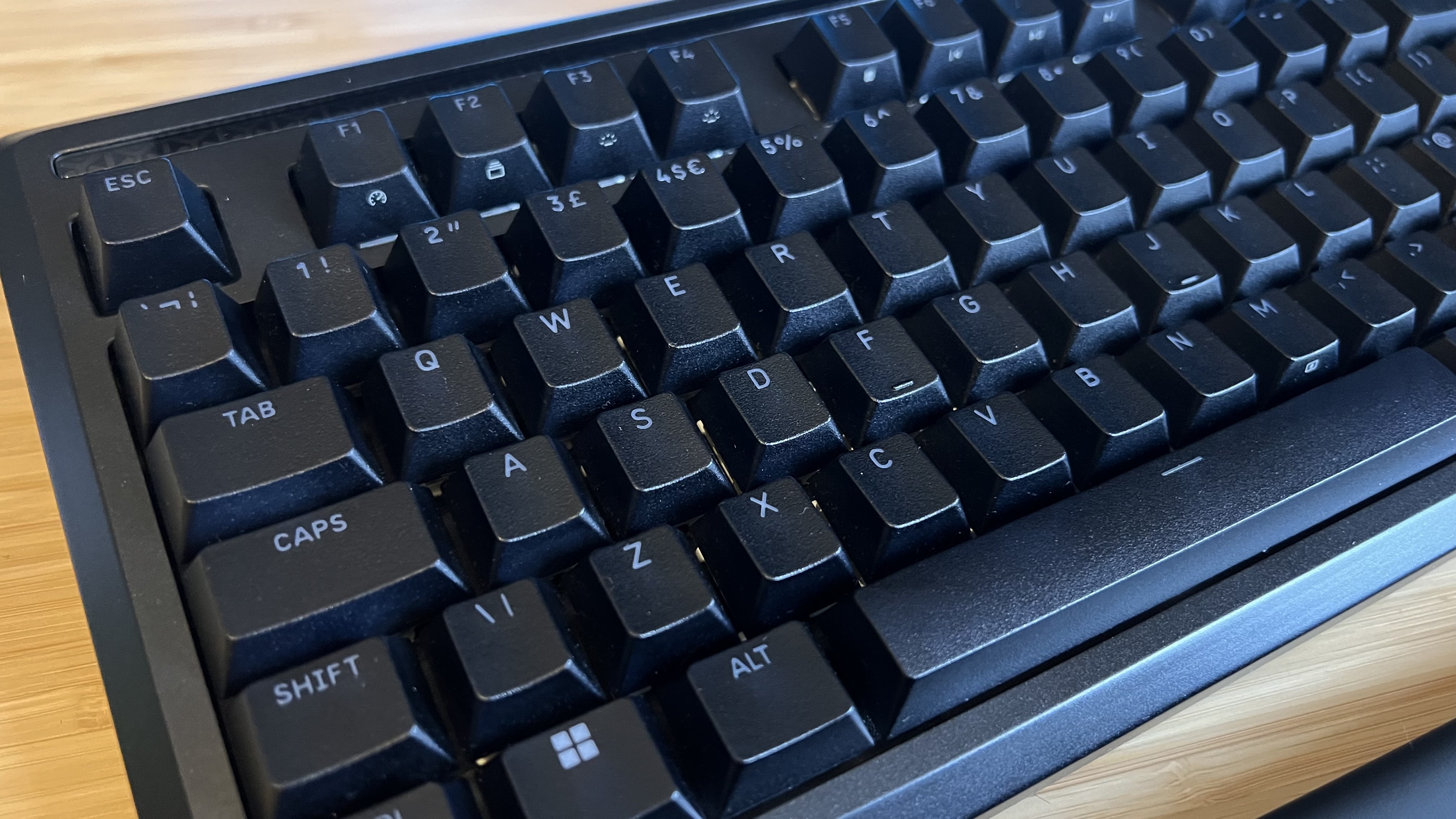 Close up on Corsair Galleon 100 SD keycaps in black, with slightly textured surface