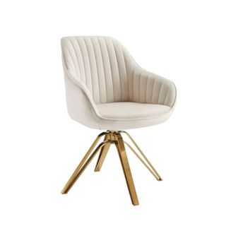 A cream colored chair with gold legs