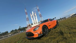 Forza Horizon 6 astrotoy photo challenge orange mercedes track toy car in front of rocket launch facility
