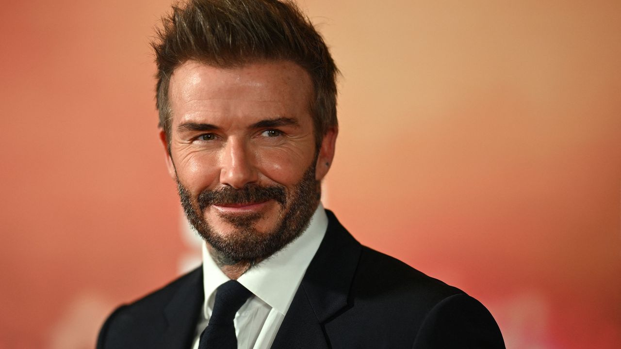 David Beckham poses on the red carpet upon arrival to attend the world premiere of the documentary &#039;99&#039;, in Manchester, northern England on May 9, 2024