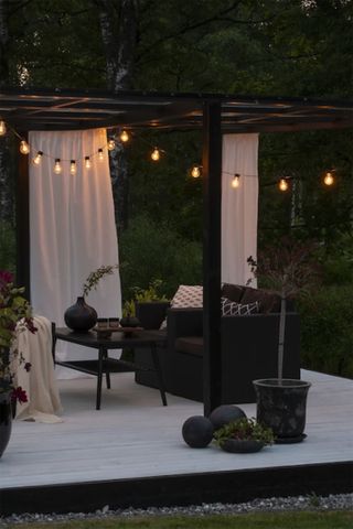 festoon light ideas: outdoor living space with pergola