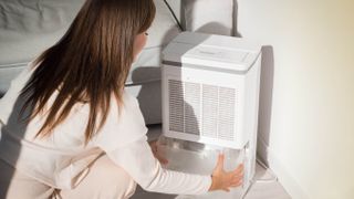 Woman cleaning humidifier