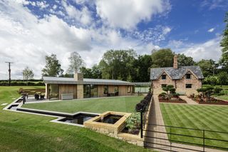 large modern extension to brick cottage