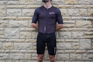 Image shows a rider wearing the NoPinz Pro-1 Road Skinsuit.