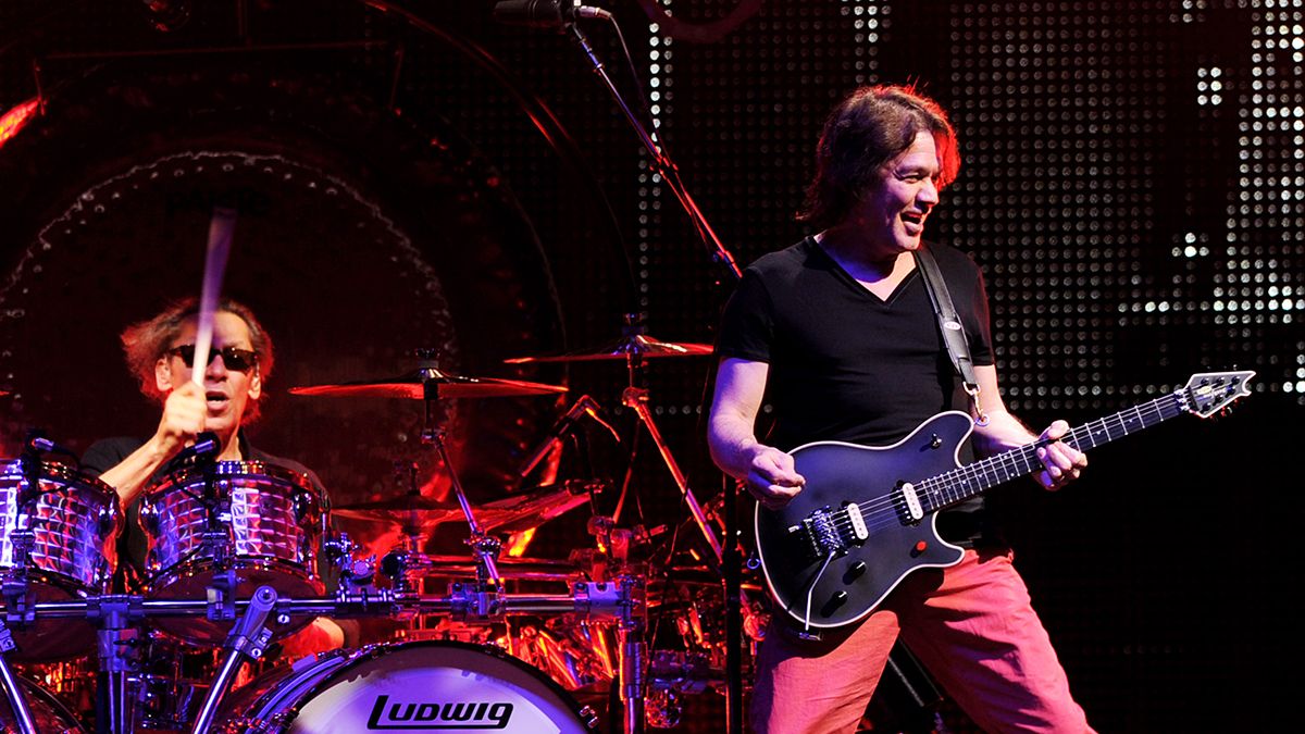 Musicians Alex Van Halen (L) and Eddie Van Halen of Van Halen perform at their dress rehearsal for family and friends at the Forum on February 8, 2012 in Inglewood, California