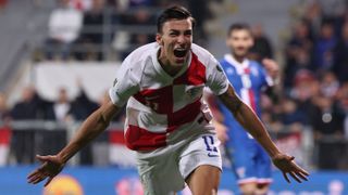 Croatia's forward #11 Peter Musa celebrates after scoring a goal during the 2026 World Cup qualifiers Europe zone group L football match between Croatia and Faroe Islands at the Stadion HNK in Rijeka, on November 14, 2025.