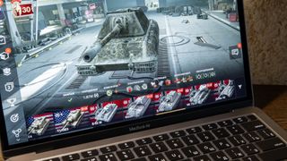a macbook with a gaming onscreen