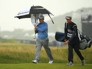 Robert MacIntyre under an umbrella during the 2019 Open