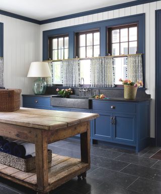 blue kitchen with antique table island