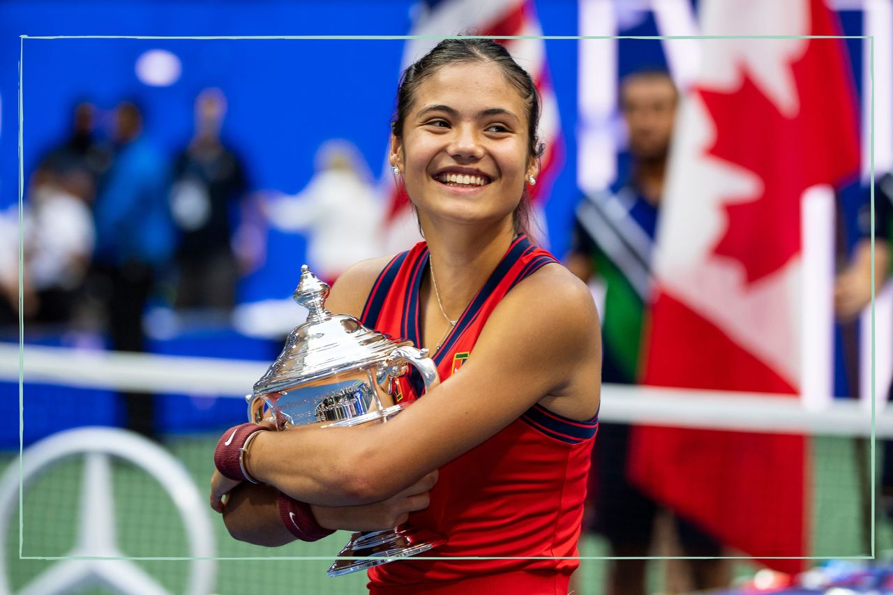 Emma Raducanu holding the US Open winners&#039; trophy after the 2021 tournament