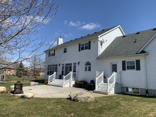 Before & After of a home in Ontario. A backyard with an outdates pathway and patio