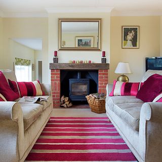 living room with fireplace sofa and cushion