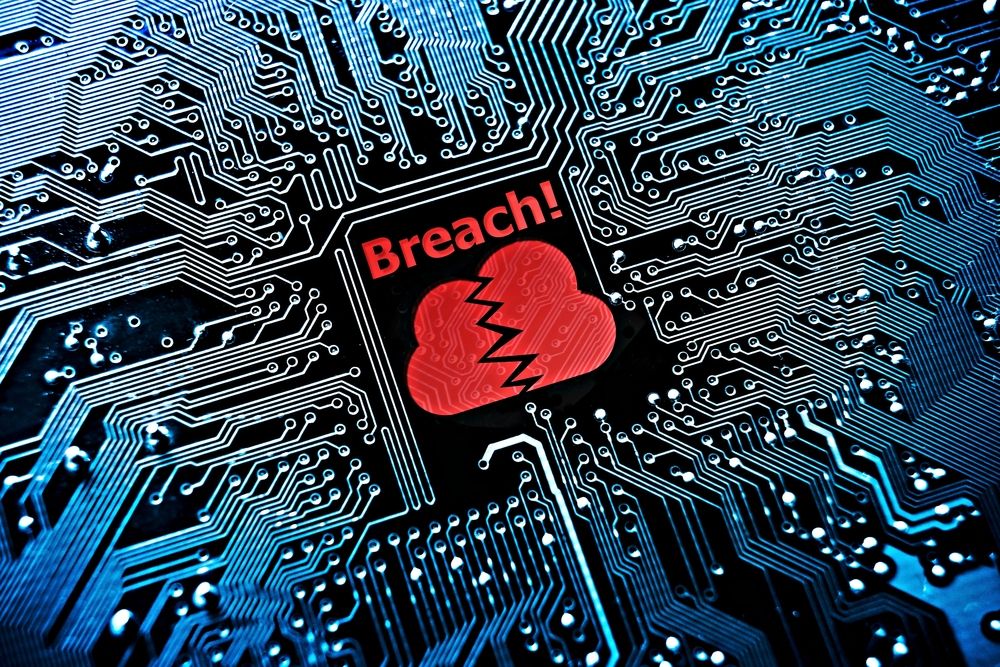 A processor with a red cloud broken in two with a word beneath: &amp;#039;BREACH!&amp;#039;