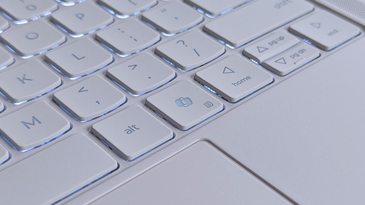 Close-up of a Lenovo Yoga Slim 7i Ultra (Gen 11) Aura Edition laptop keyboard showing keys like "alt," directional arrows, and a Windows Copilot key.