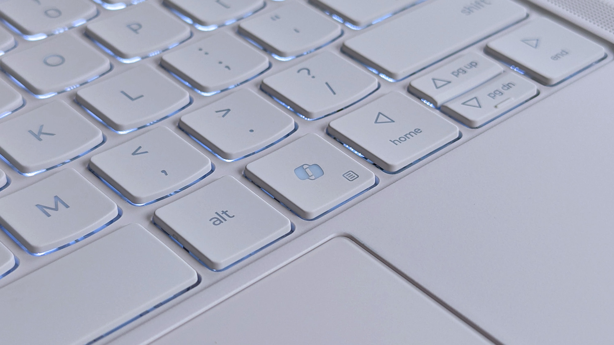 Close-up of a Lenovo Yoga Slim 7i Ultra (Gen 11) Aura Edition laptop keyboard showing keys like "alt," directional arrows, and a Windows Copilot key.