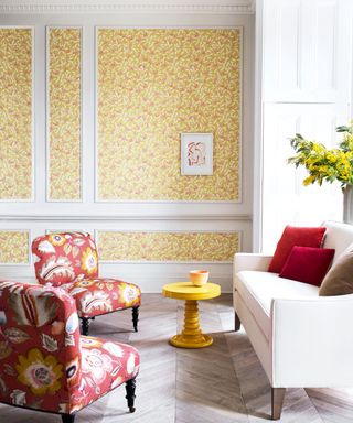 yellow floral wallpaper on wall panels in a sitting room