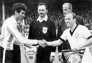 Argentina captain Antonio Rattin shakes hands with West Germany skipper Uwe Seeler ahead of the teams' meeting at the 1966 World Cup.