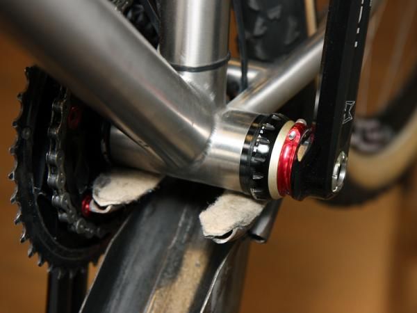 The KCNC cranks on Fairwheel Bikes' Shimano Dura-Ace Di2-equipped Titus titanium 29er hardtail uses a threaded collar to fine-tune the bearing preload.