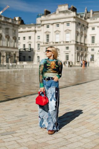 Rebecca wears patchwork denim jeans