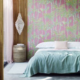 bedroom design with whimsical palm design with its deep sunset pinks