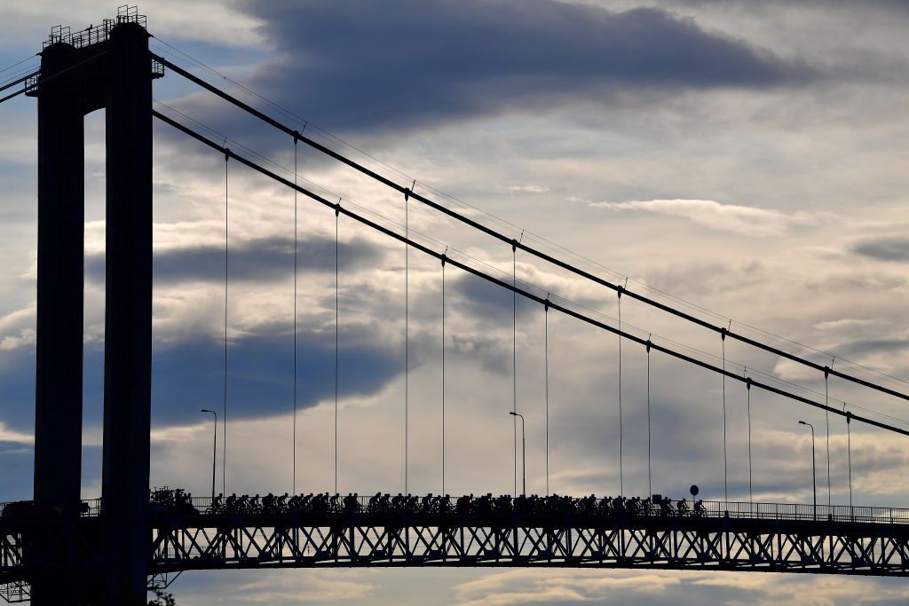 HARSTAD NORWAY AUGUST 08 The Peloton passing through Tjeldsund Bridge during the 8th Arctic Race Of Norway 2021 Stage 4 a 1635km stage from Gratangen to Harstad 54m ArcticRace on August 08 2021 in Harstad Norway Photo by Stuart FranklinGetty Images