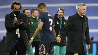 PSG's Kylian Mbappe shakes hands with Real Madrid coach Carlo Ancelotti after the teams' Champions League clash at the Santiago Bernabeu in 2022.