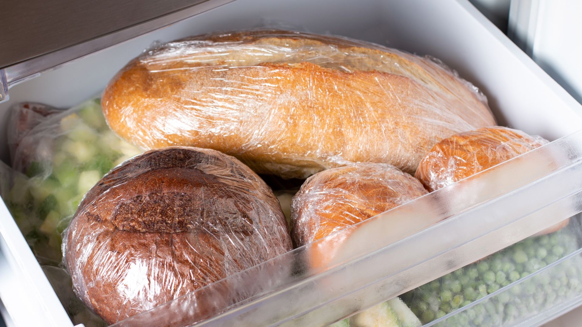 Various loaves of bread in the freezer